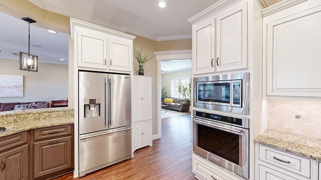 kitchen featuring white cabinetry, ornamental molding, and stainless steel appliances