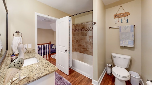 full bathroom with wood-type flooring, toilet, vanity, and shower / bath combo with shower curtain