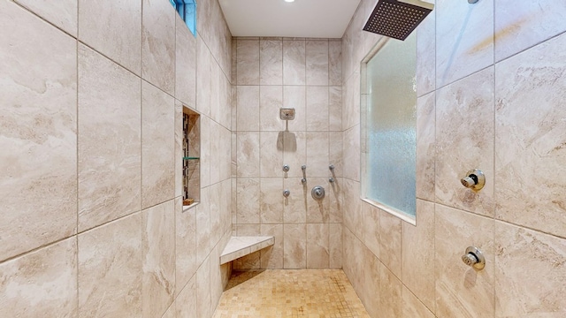 bathroom featuring a tile shower