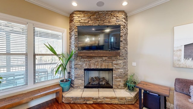 living room with dark hardwood / wood-style flooring, crown molding, and plenty of natural light