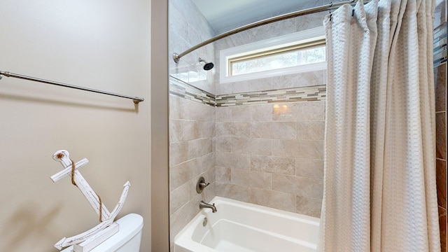 bathroom featuring toilet and shower / bath combo with shower curtain