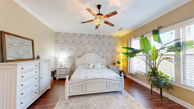 bedroom with crown molding and dark hardwood / wood-style flooring