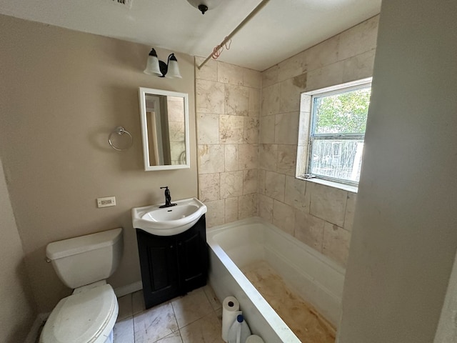 bathroom with shower / bathtub combination, toilet, vanity, and tile patterned flooring