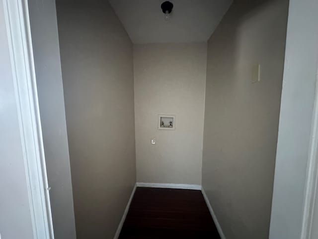 hall with dark wood-style floors and baseboards