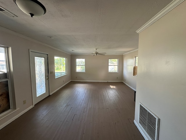 unfurnished living room with a ceiling fan, dark wood-style floors, visible vents, baseboards, and crown molding