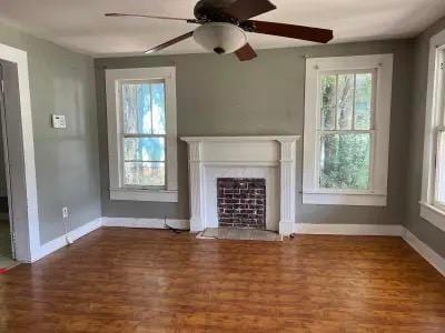 unfurnished living room featuring dark hardwood / wood-style floors