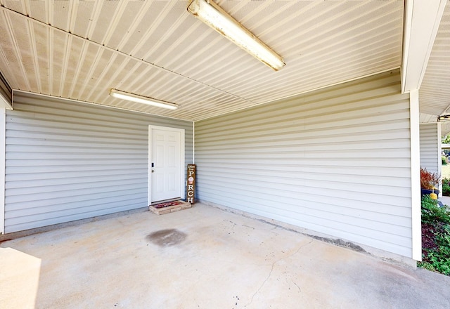 exterior space with a patio and a carport