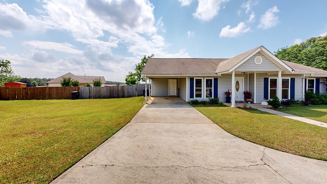 single story home with concrete driveway, an attached carport, fence, and a front lawn
