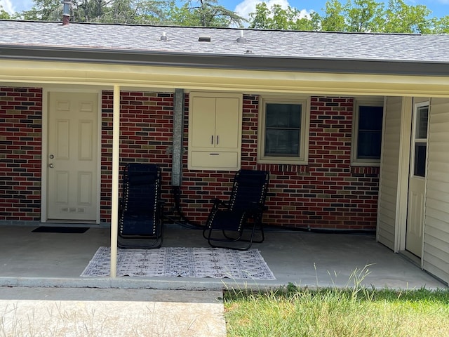 16 Holman St, Daleville, AL 36322 - property entrance with brick siding and a shingled roof