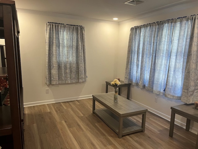 16 Holman St, Daleville, AL 36322 - sitting room with wood finished floors, ornamental molding, and recessed lighting