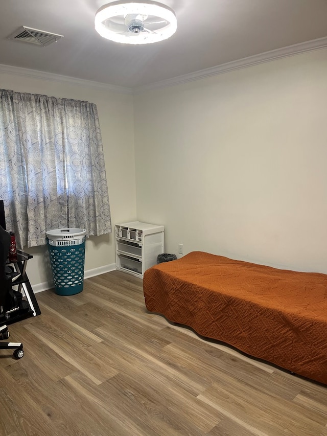 16 Holman St, Daleville, AL 36322 - bedroom featuring crown molding and wood finished floors