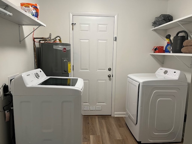 16 Holman St, Daleville, AL 36322 - laundry room featuring water heater, independent washer and dryer, and wood finished floors