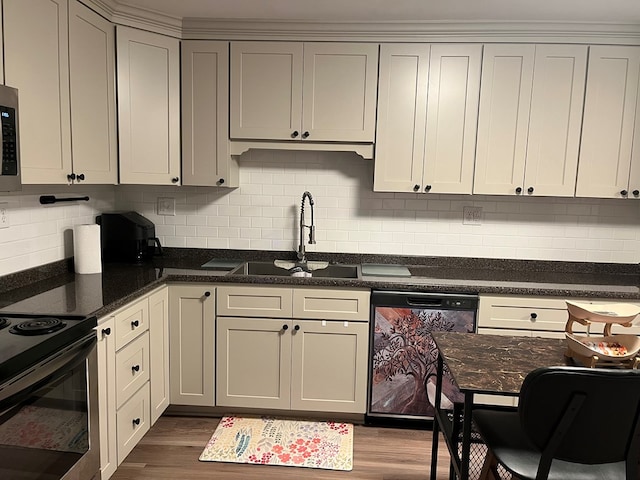 16 Holman St, Daleville, AL 36322 - kitchen featuring appliances with stainless steel finishes, decorative backsplash, dark wood-style flooring, and gray cabinets