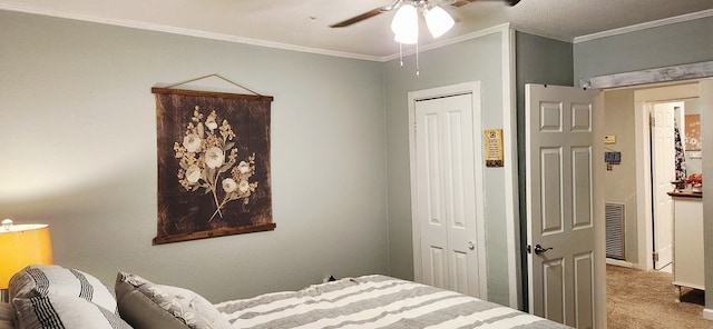 207 W Pullum St, Samson, AL 36477 - bedroom with ornamental molding, a closet, carpet flooring, and ceiling fan