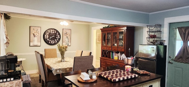 207 W Pullum St, Samson, AL 36477 - dining room featuring crown molding and baseboards