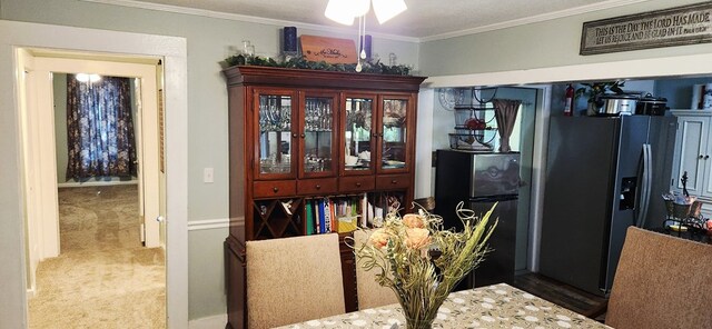 207 W Pullum St, Samson, AL 36477 - dining area featuring ornamental molding and carpet
