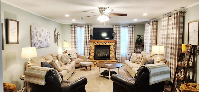 207 W Pullum St, Samson, AL 36477 - living area featuring a ceiling fan, crown molding, a stone fireplace, plenty of natural light, and carpet