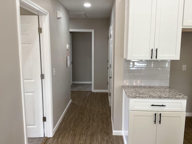 corridor featuring dark wood-type flooring