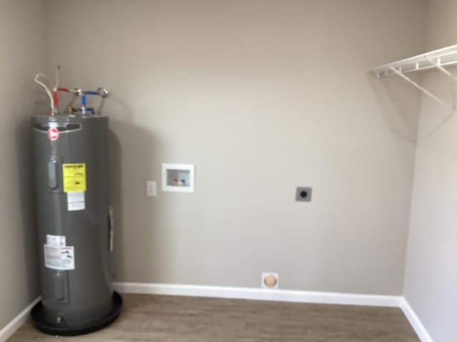 utility room featuring water heater