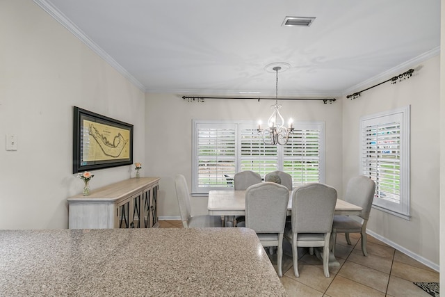 108 Mulberry Ct, Dothan, AL 36303 - dining space featuring a chandelier, light tile patterned floors, crown molding, and plenty of natural light
