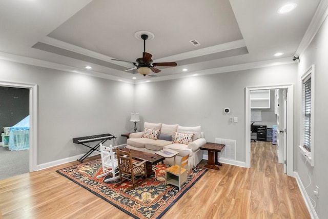 108 Mulberry Ct, Dothan, AL 36303 - living area featuring a raised ceiling, ornamental molding, a ceiling fan, light wood-style floors, and recessed lighting