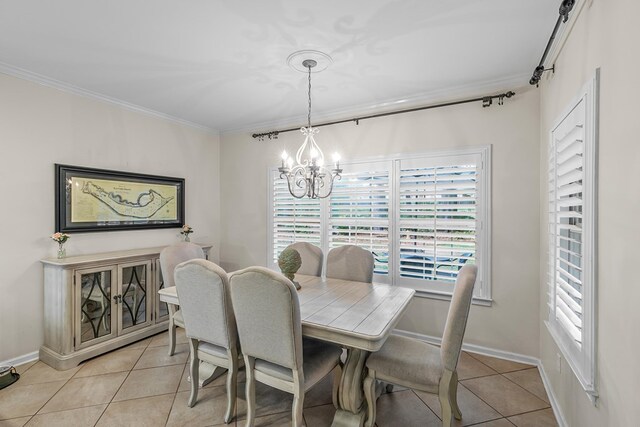 108 Mulberry Ct, Dothan, AL 36303 - dining space with light tile patterned flooring, crown molding, and a chandelier