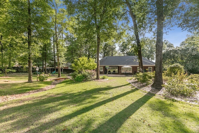 108 Mulberry Ct, Dothan, AL 36303 - view of green lawn featuring view of wooded area