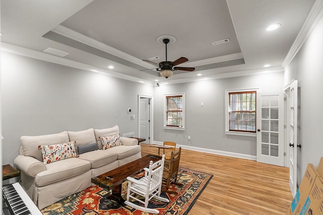 108 Mulberry Ct, Dothan, AL 36303 - living area featuring a tray ceiling, a ceiling fan, light wood-style floors, crown molding, and recessed lighting