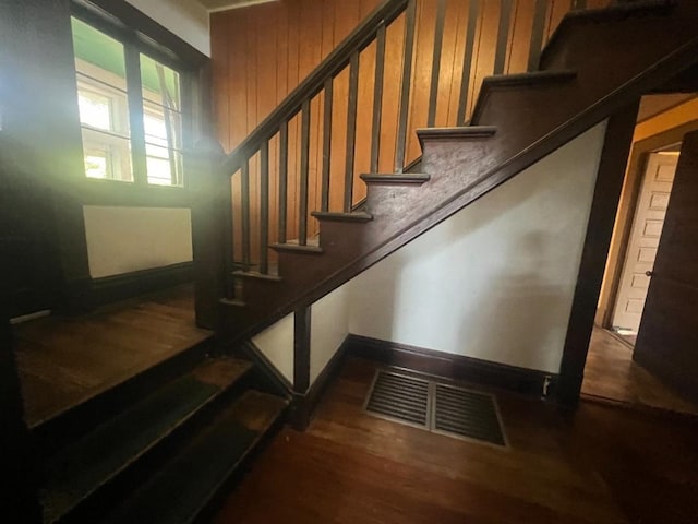 stairway with wood-type flooring