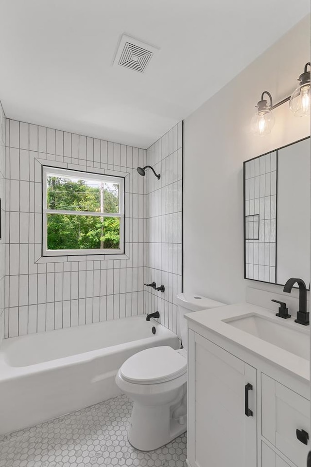 685 Hodgesville Rd, Dothan, AL 36301 - bathroom featuring tile patterned flooring, vanity, bathtub / shower combination, toilet, and visible vents