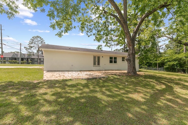 685 Hodgesville Rd, Dothan, AL 36301 - back of property featuring a lawn, a patio, french doors, and stucco siding