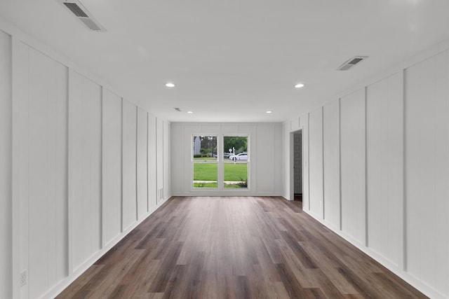 685 Hodgesville Rd, Dothan, AL 36301 - empty room featuring visible vents, recessed lighting, dark wood finished floors, and a decorative wall