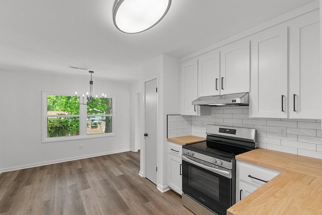 685 Hodgesville Rd, Dothan, AL 36301 - kitchen featuring wood counters, backsplash, under cabinet range hood, and stainless steel electric range