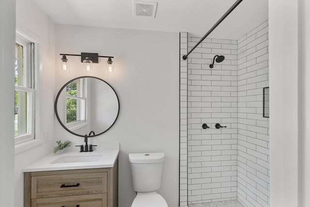 685 Hodgesville Rd, Dothan, AL 36301 - full bathroom featuring toilet, visible vents, a tile shower, and vanity