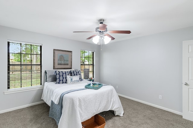 bedroom featuring carpet flooring, baseboards, and a ceiling fan