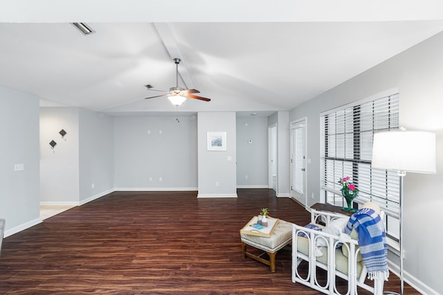 living room with wood finished floors, a ceiling fan, and baseboards
