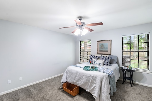 bedroom featuring carpet floors, baseboards, and ceiling fan