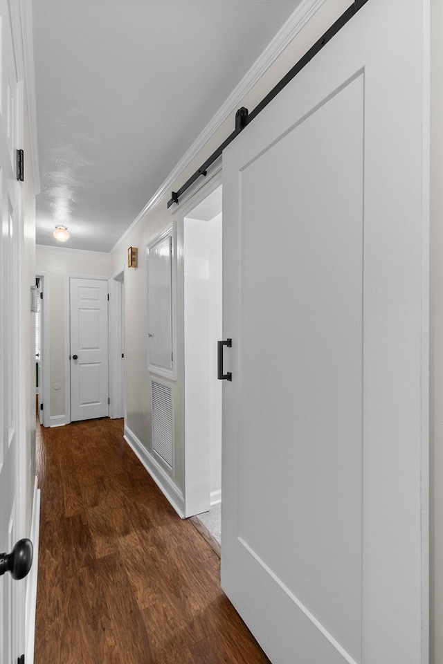 1906 Sullivan Dr, Dothan, AL 36303 - corridor featuring wood finished floors, baseboards, crown molding, and a barn door