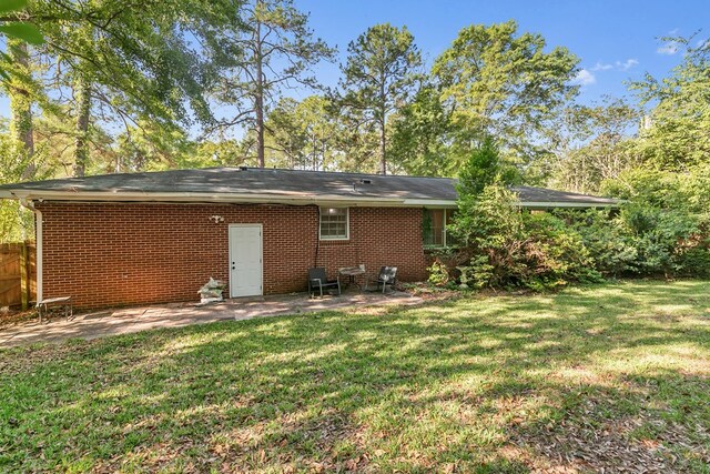 1906 Sullivan Dr, Dothan, AL 36303 - back of property with a patio area and brick siding