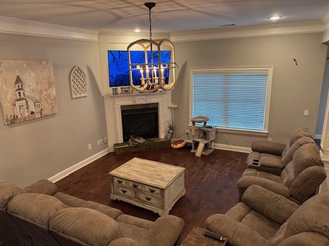 living room featuring crown molding, a fireplace with raised hearth, wood finished floors, baseboards, and recessed lighting