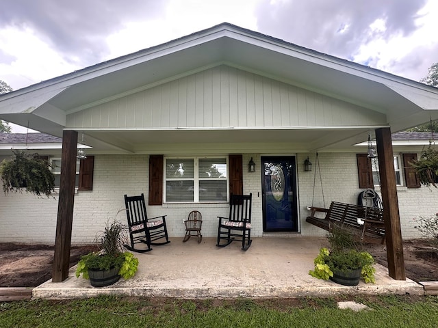 178 W Lawrence Harris Hwy, Slocomb, AL 36375 - view of front facade with brick siding and a porch
