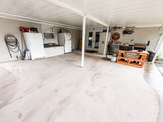 178 W Lawrence Harris Hwy, Slocomb, AL 36375 - garage with freestanding refrigerator and french doors