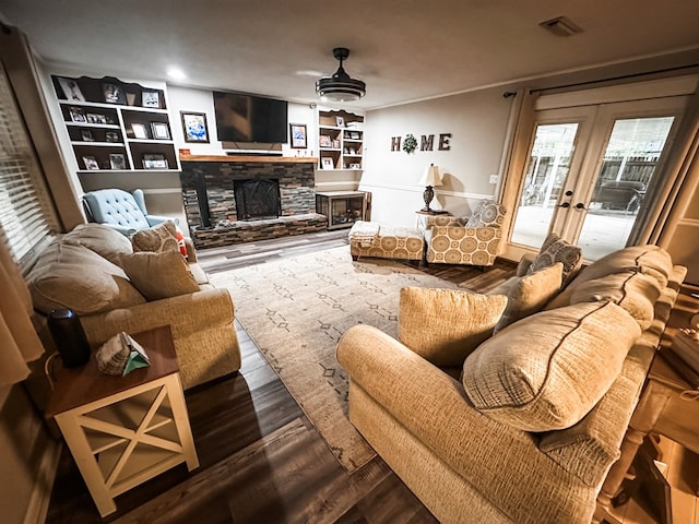 178 W Lawrence Harris Hwy, Slocomb, AL 36375 - living area featuring french doors, a stone fireplace, wood finished floors, and built in features