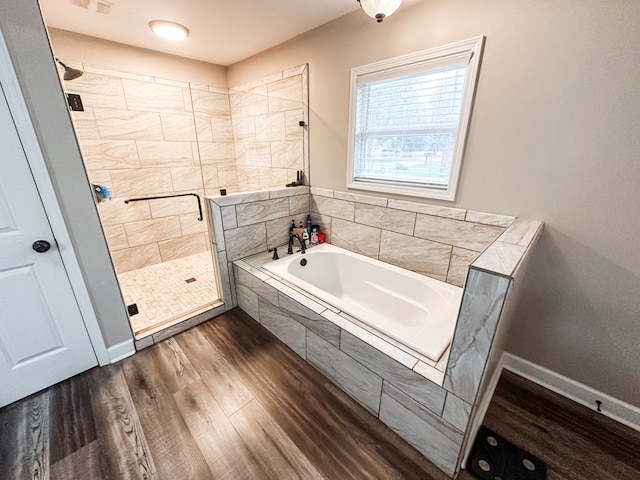178 W Lawrence Harris Hwy, Slocomb, AL 36375 - full bathroom with a garden tub, a stall shower, and wood finished floors
