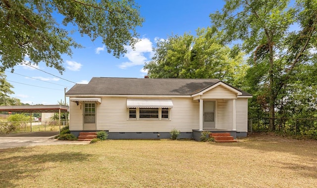 view of front of house featuring a front yard and a carport