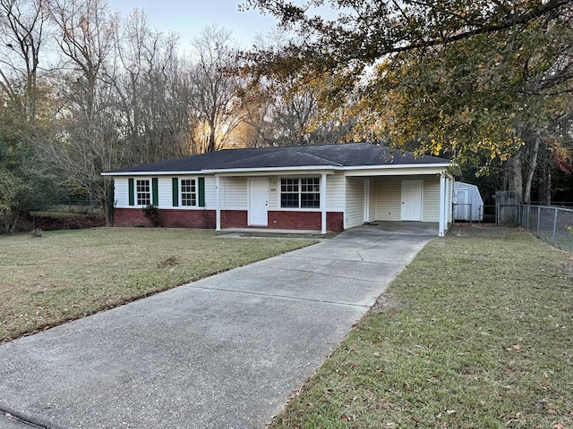 single story home with a front lawn and a carport