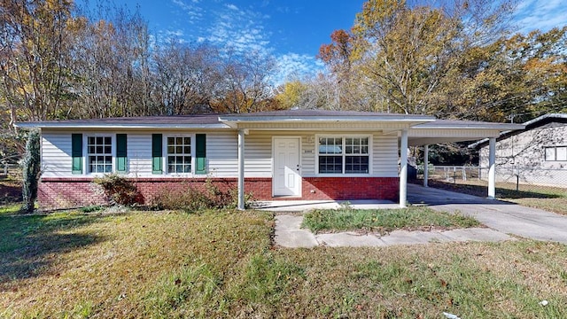 ranch-style home with a carport and a front lawn