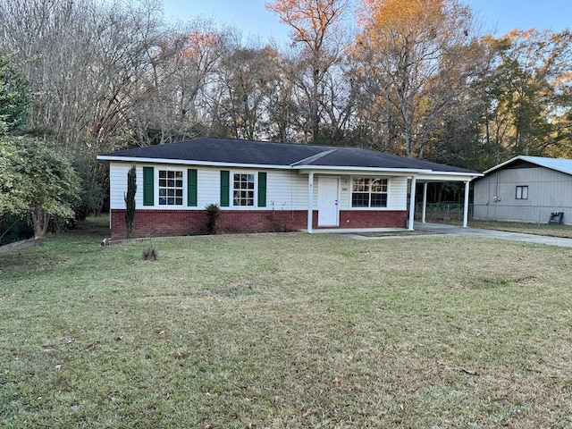 single story home with a front yard and a carport