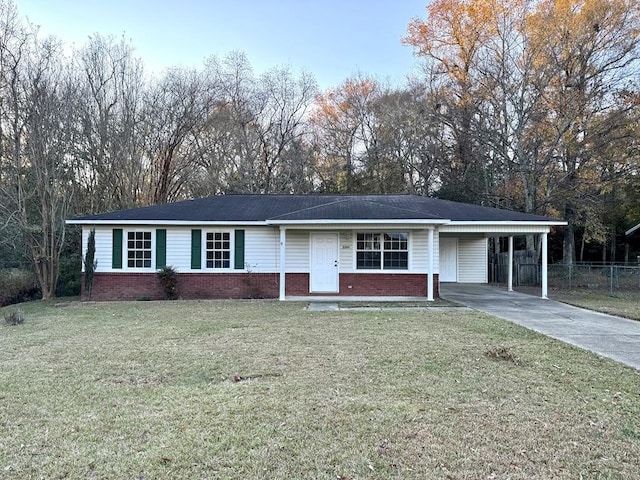 ranch-style house with a carport and a front yard