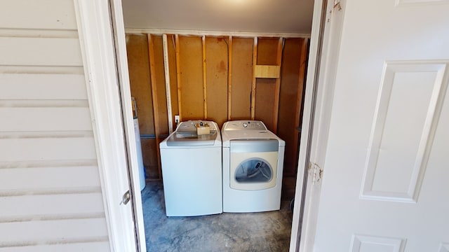 laundry room featuring washing machine and clothes dryer